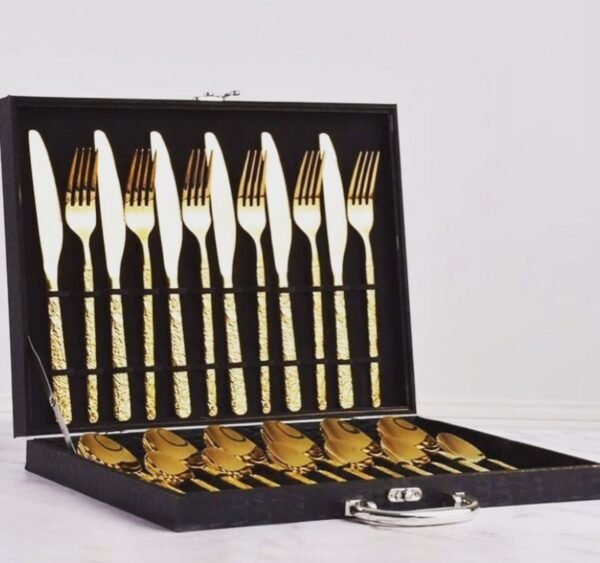 A luxurious gold-plated cutlery set featuring a modern textured design, complete with an elegant storage case for sophistication and organization.